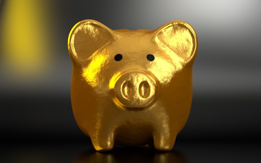 A gold piggy bank on a reflecting table