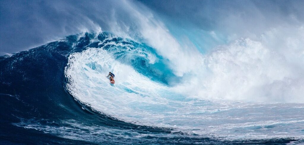 A surfer surfing on a big wave